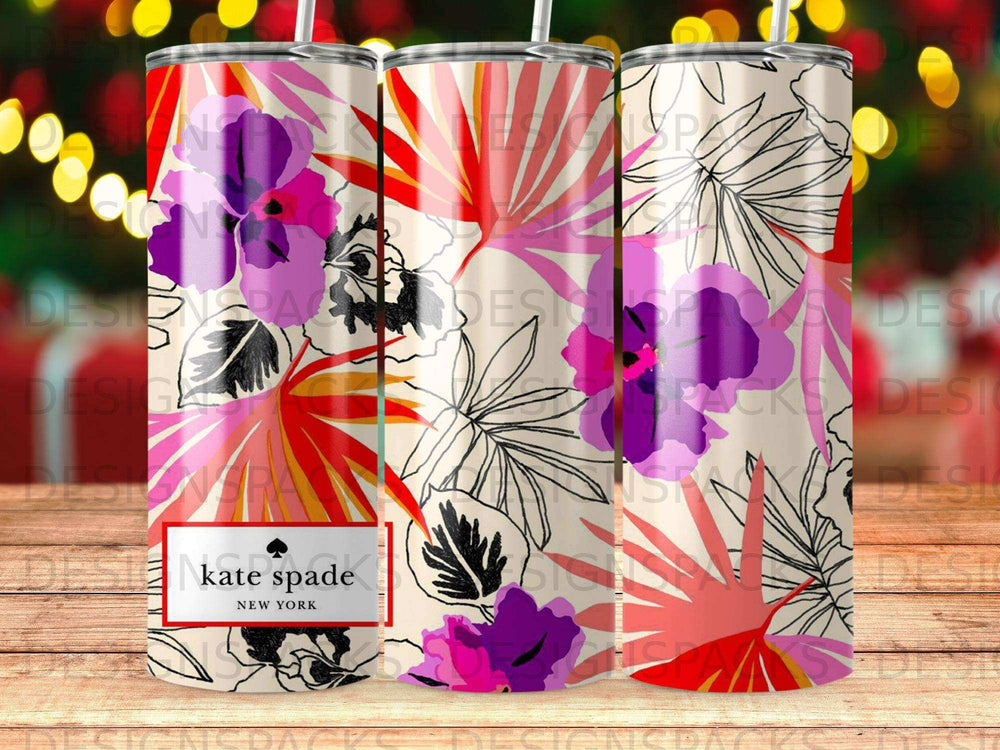 Kate Spade tumbler with floral and palm leaf pattern.