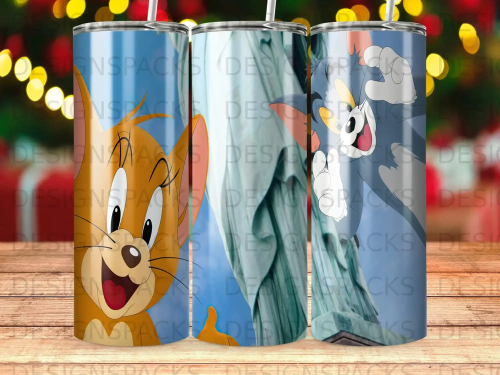 Tom and Jerry characters on a Statue of Liberty background with "DESIGNSPACKS" watermark.