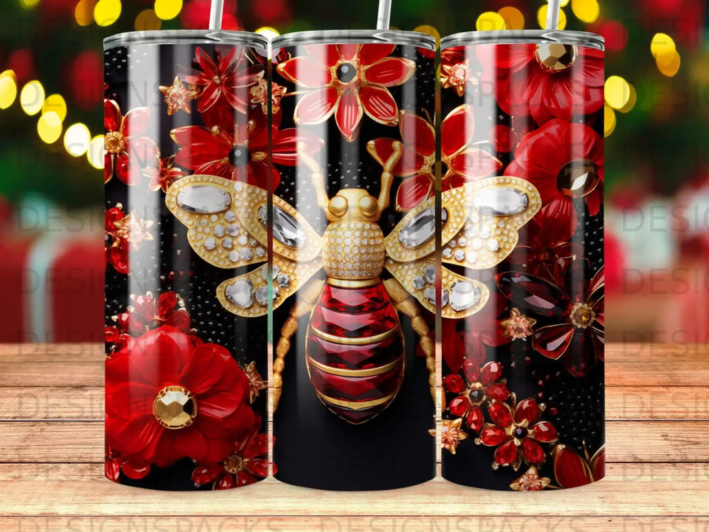 Gold bee with ruby-red flowers and diamonds on a black tumbler.
