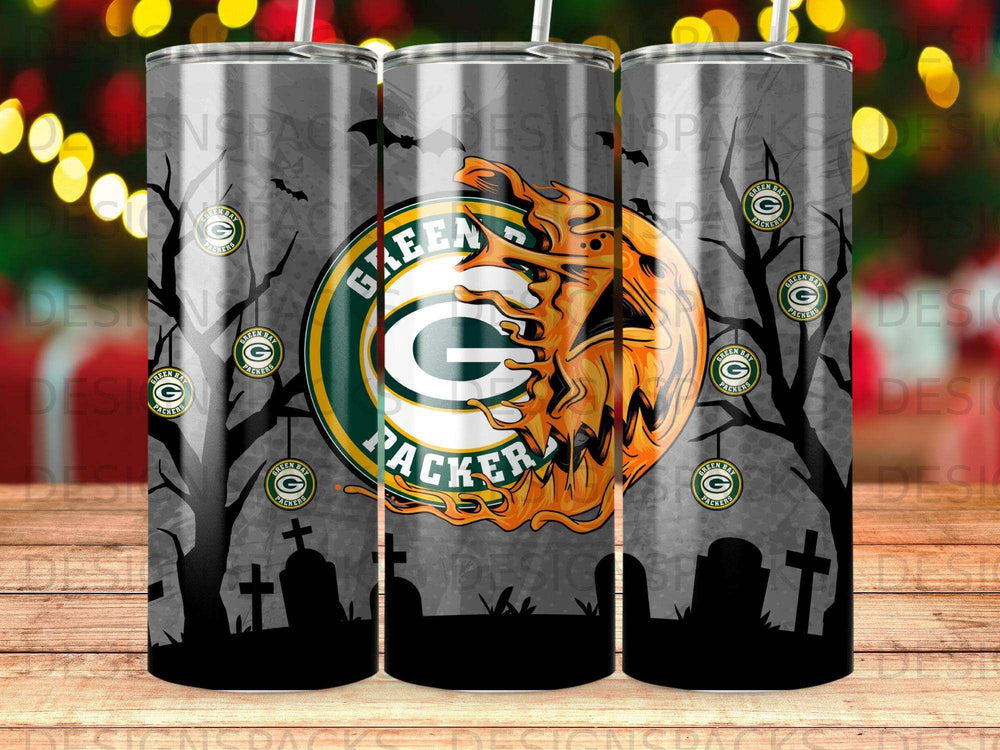 Green Bay Packers logo on a Halloween-themed tumbler with trees and gravestones.