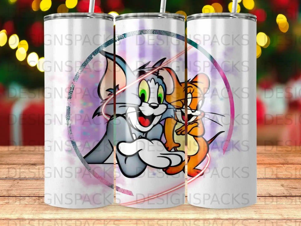 Tom and Jerry characters on a colorful tumbler with "DESIGNSPACKS" watermark.
