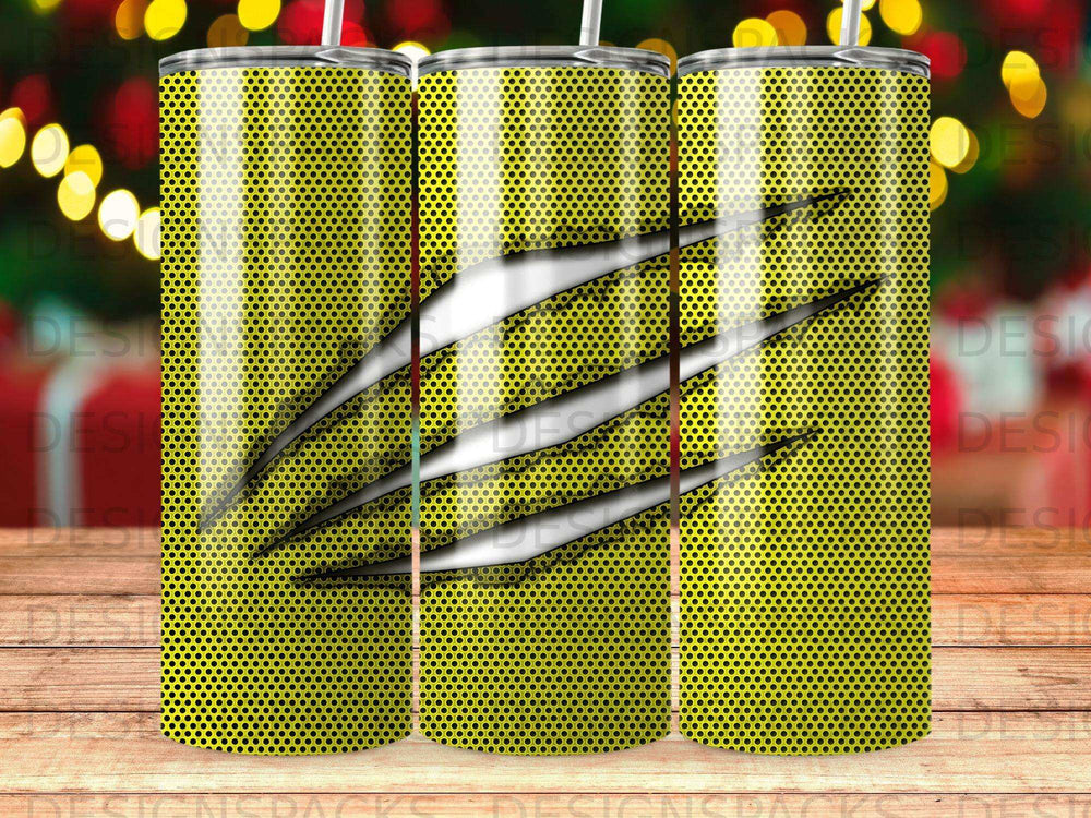 Yellow tumbler with black dots and silver claw marks.