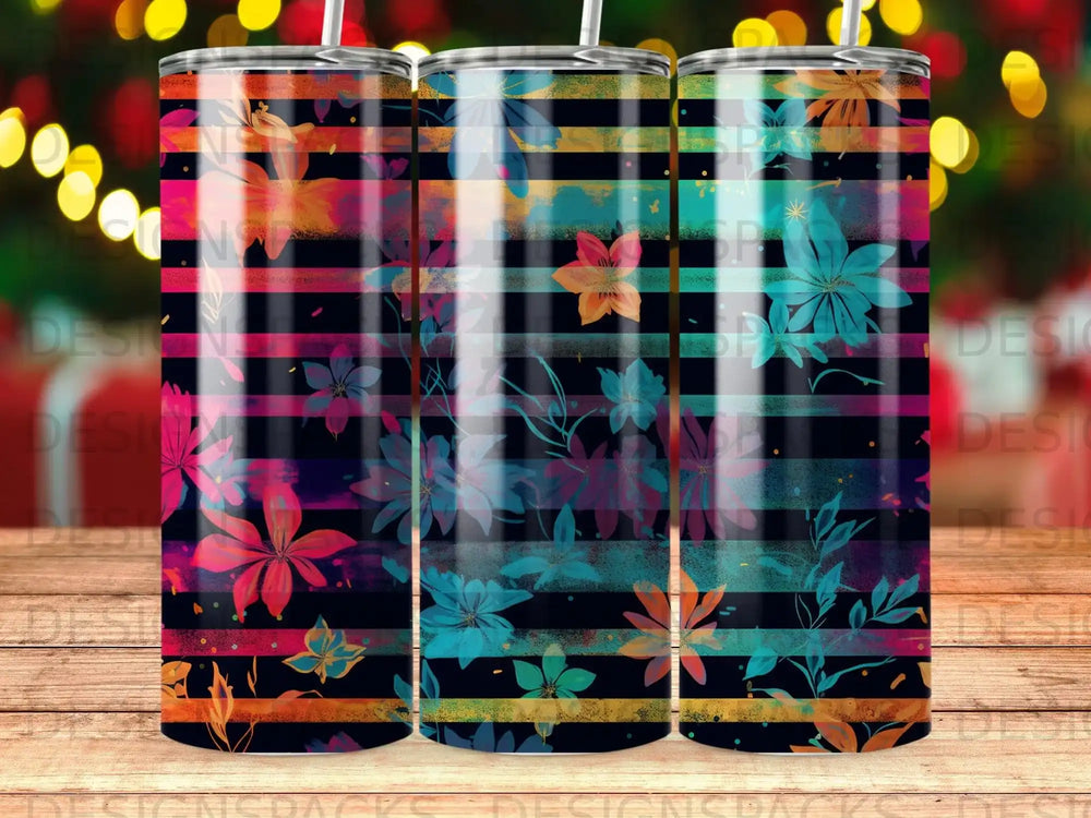 Striped tumbler with colorful floral pattern and bokeh background.