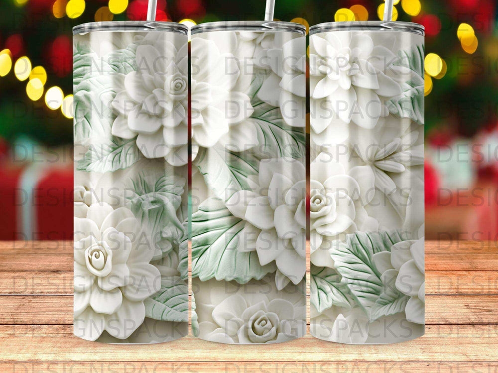 White floral relief on a tumbler with a bokeh background.