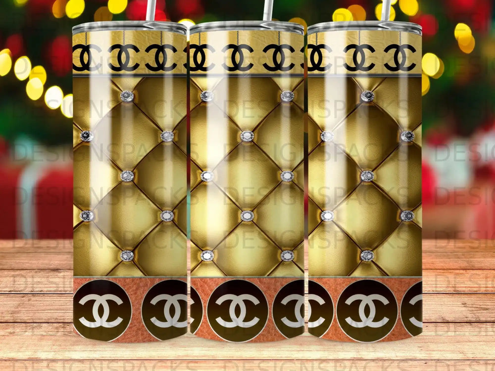 Gold tumbler with quilted pattern and interlocking C logo.