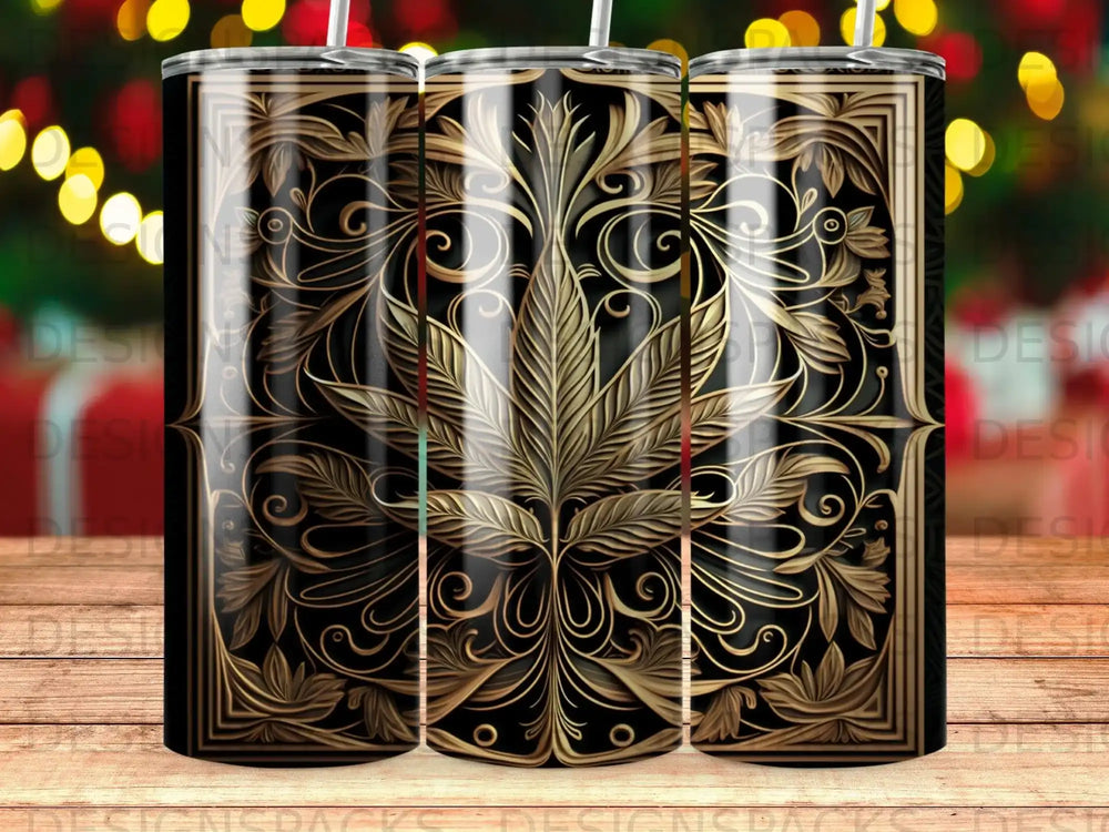 Black tumbler with gold cannabis leaf and ornate scrolling patterns.
