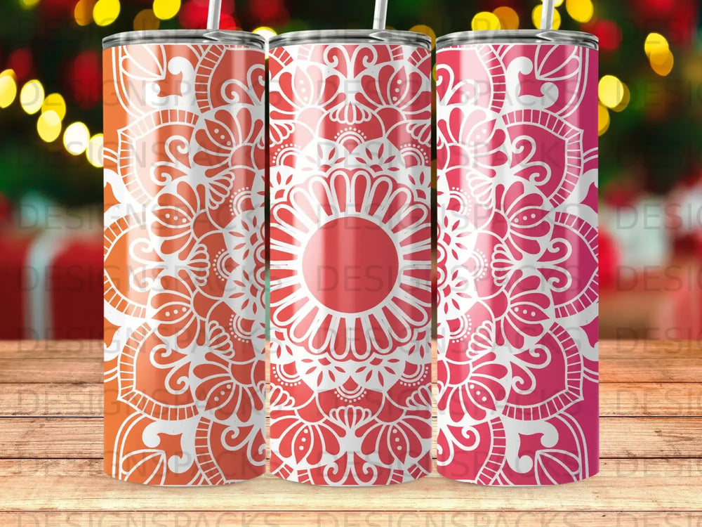 Three tumblers with red and orange mandala patterns.