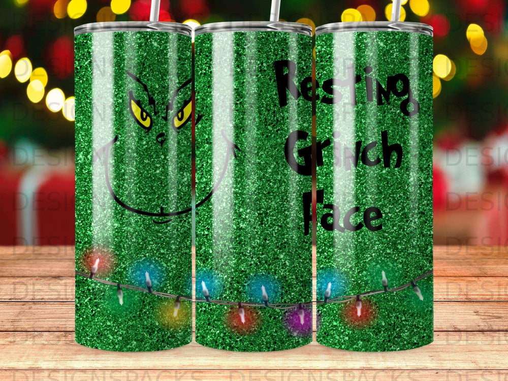 Grinch tumbler with green glitter and Christmas lights, reads "Resting Grinch Face."