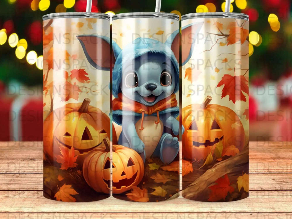 Blue cartoon character with pumpkins and autumn leaves on a tumbler.