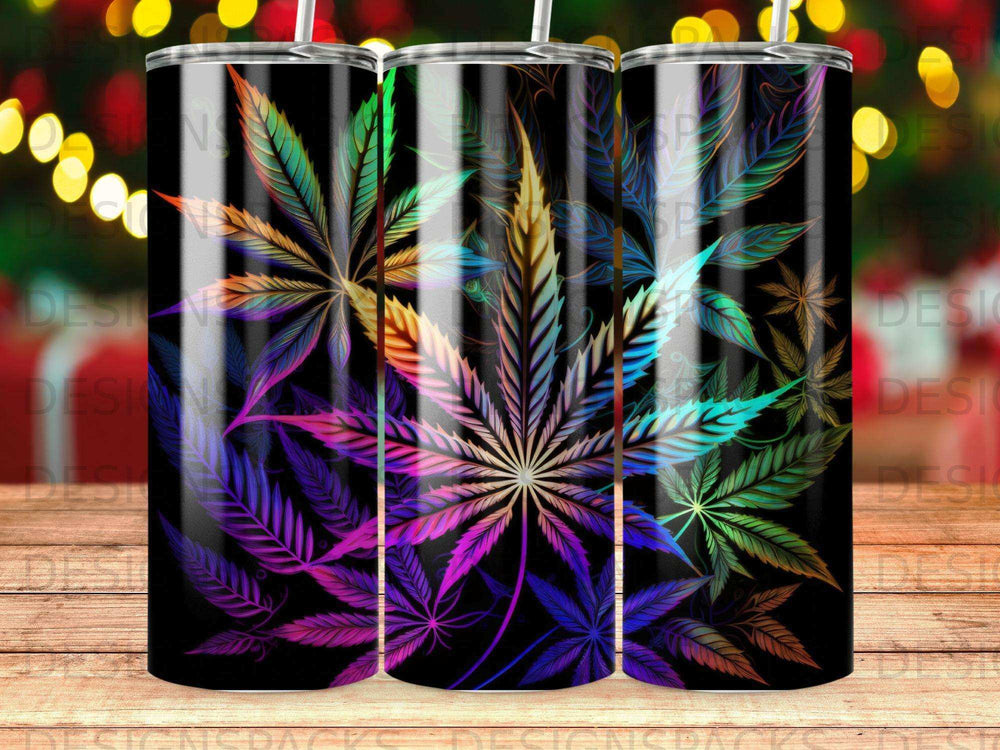 Marijuana leaf design on a black skinny tumbler with colorful ombre gradient.