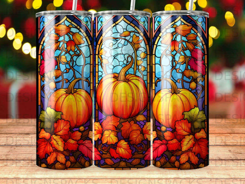 Stained glass pattern with pumpkins and autumn leaves on a tumbler.
