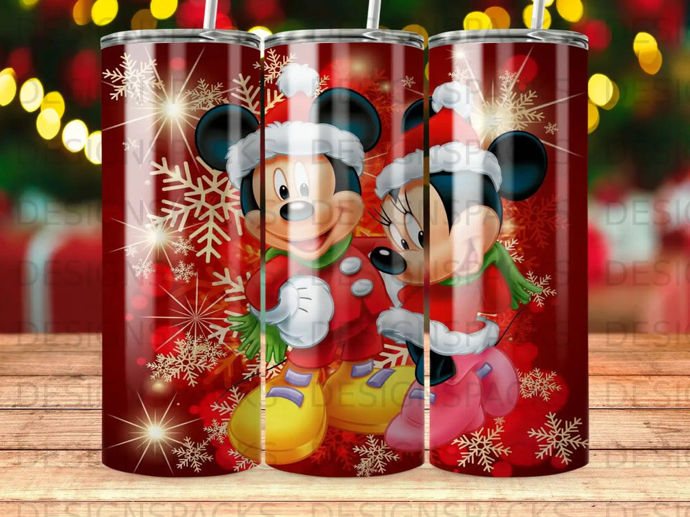 Mickey and Minnie Mouse in Santa hats surrounded by snowflakes.