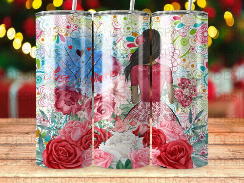 Tumbler with colorful floral design and text 