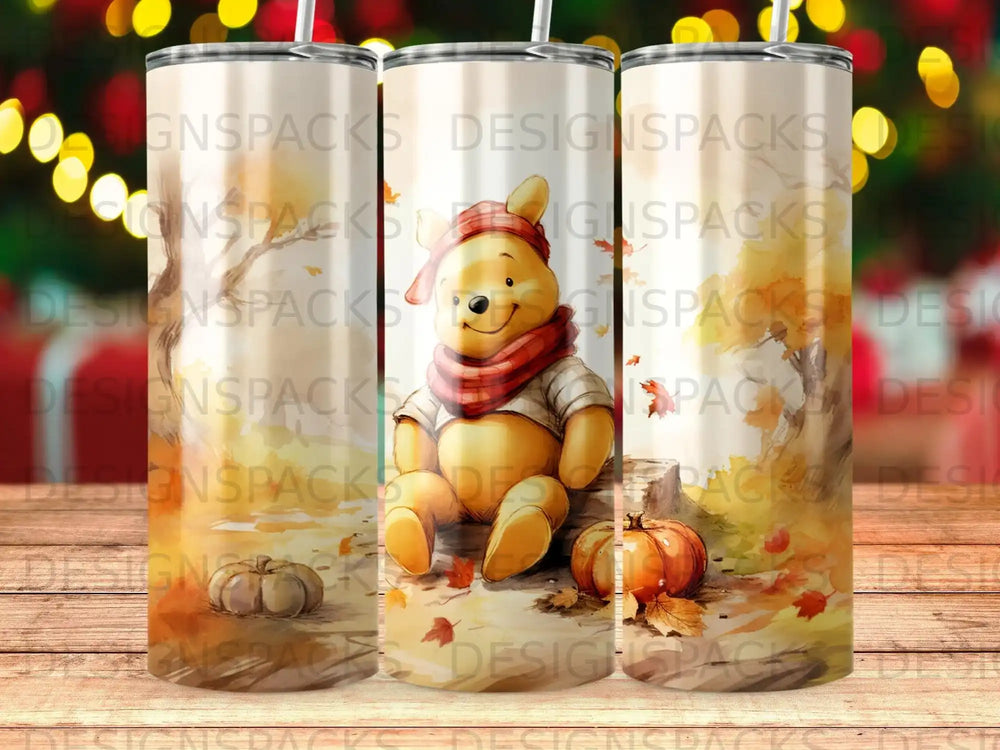 Winnie the Pooh sitting among autumn leaves.