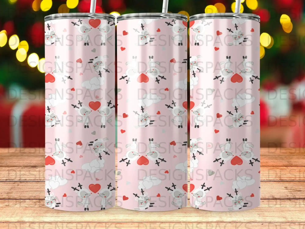 Pink tumbler with white sheep, hearts, and crosses pattern.