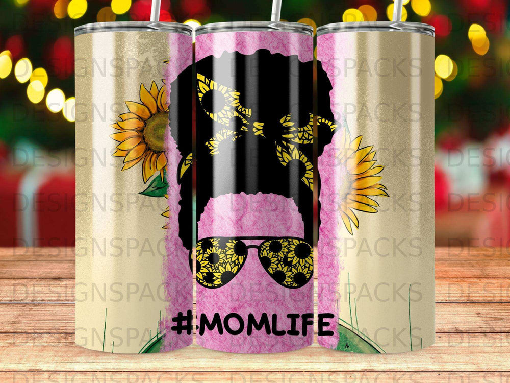 Sunflower-patterned tumbler with #MOMLIFE text and woman's silhouette.