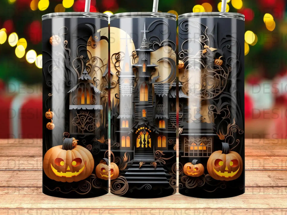 Halloween tumbler with haunted house and jack-o'-lanterns.
