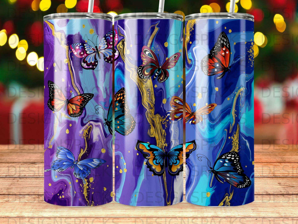 Purple tumbler with abstract blue and gold marbling and colorful butterflies.