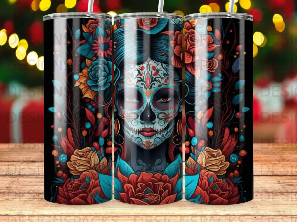 Day of the Dead skull art with flowers on a black tumbler.