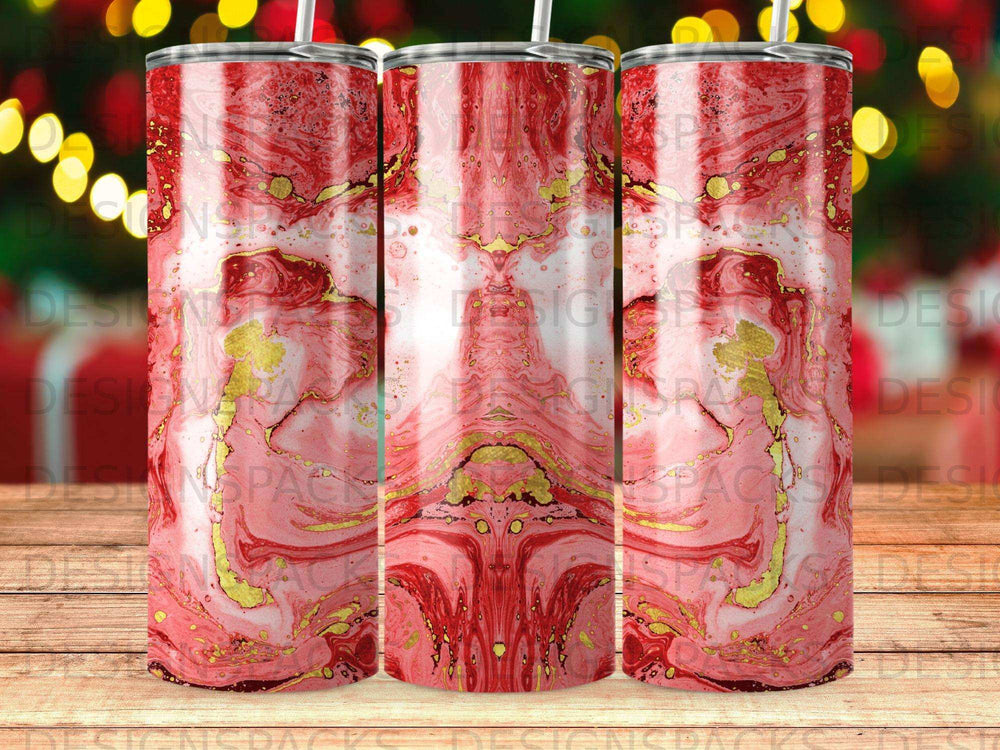 Red and gold marbled tumbler with holiday lights background.