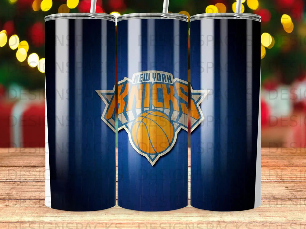 New York Knicks logo on a blue tumbler with blurred lights background.