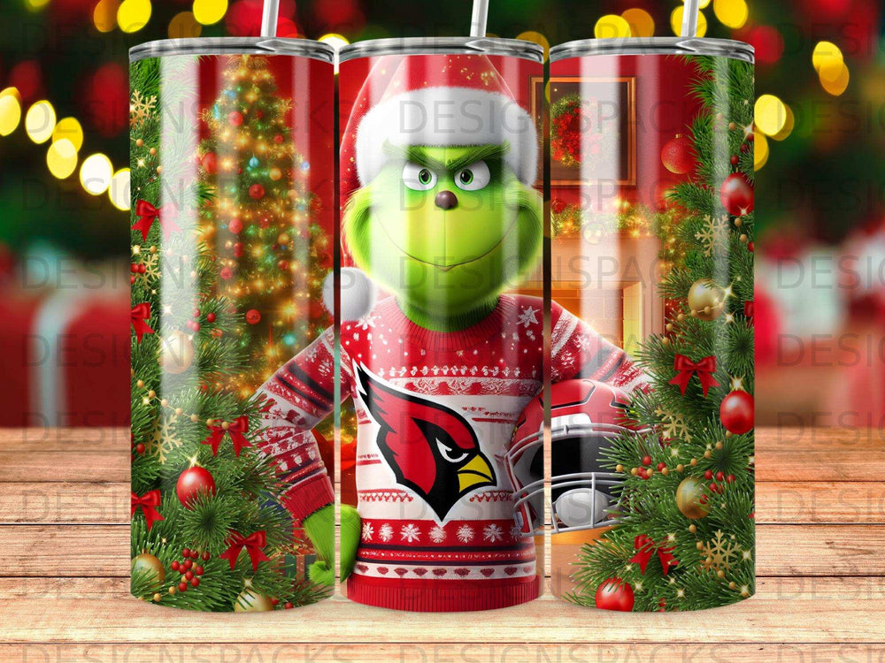 Grinch in Santa hat and ugly Christmas sweater holding Cardinals helmet.