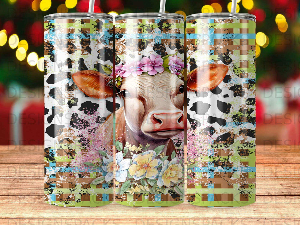 Cow with floral crown and camouflage pattern tumbler.