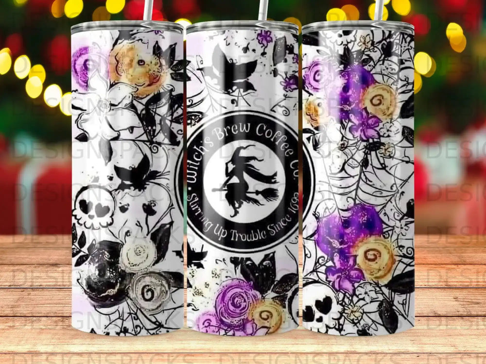 Witch's Brew Coffee tumbler with floral and skull design.
