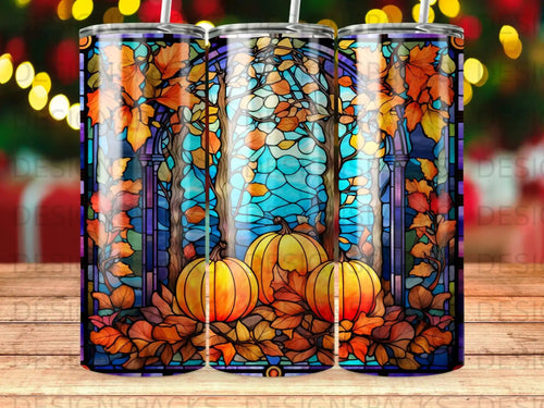 Stained glass art tumbler with pumpkins and fall leaves.