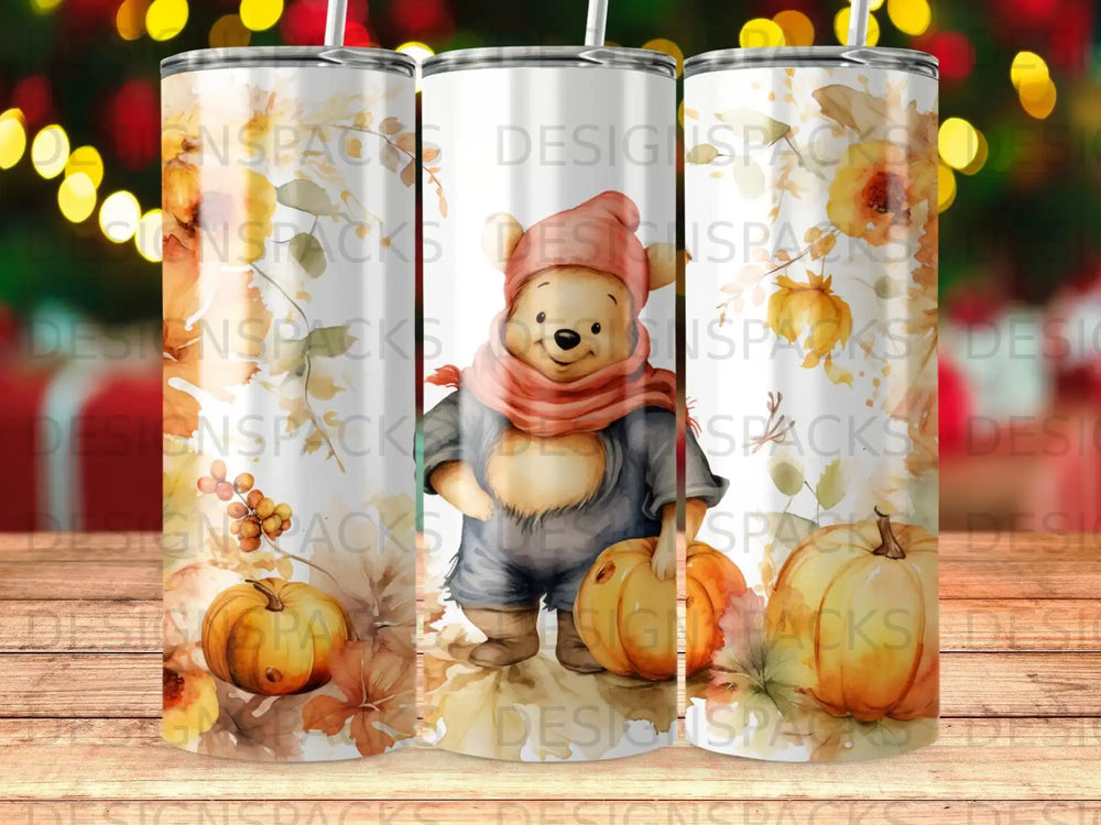 Winnie the Pooh in fall attire holding a pumpkin, surrounded by autumn leaves.