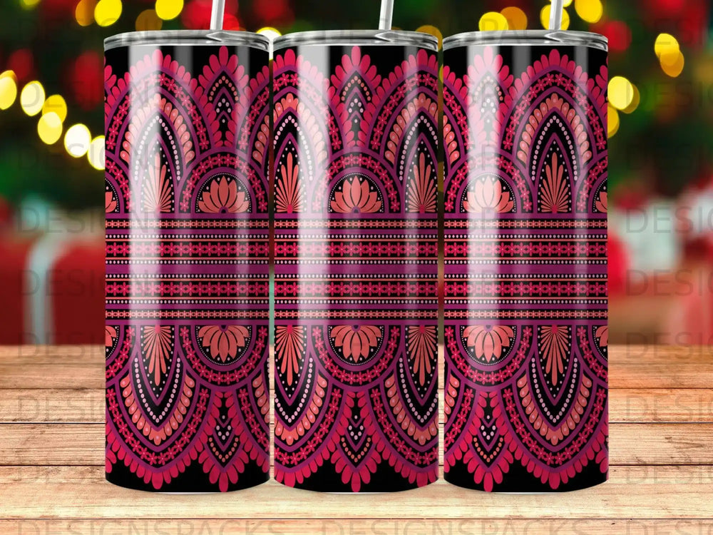 Pink and purple mandala pattern on three tumblers on a wooden surface.