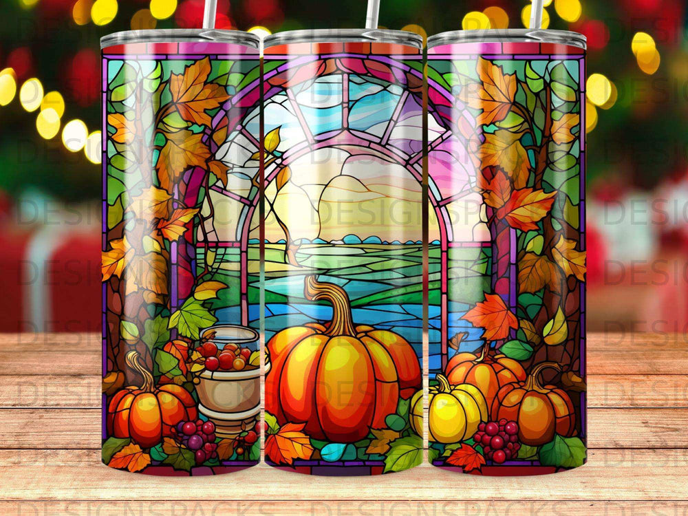 Stained glass design with pumpkins, autumn leaves, and a harvest scene.