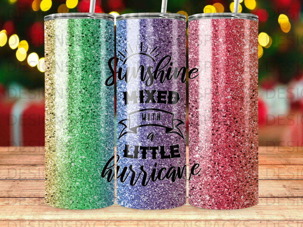 Three tumblers with glittery ombre designs, reading "Sunshine Mixed with a Little Hurricane".