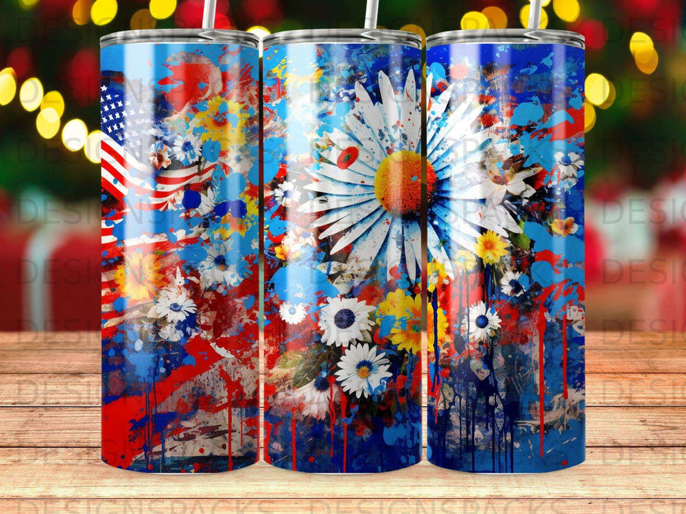 Floral patriotic tumbler with American flag design and vibrant paint splatters.