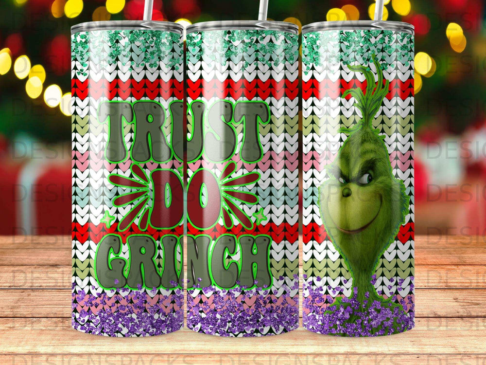 Grinch tumbler with "Trust the Grinch" text and green, white, and red knitted pattern.