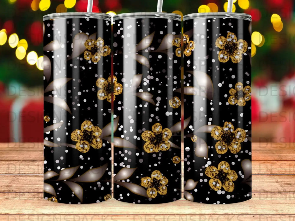 Black tumbler with gold floral and polka dot pattern, three side-by-side.
