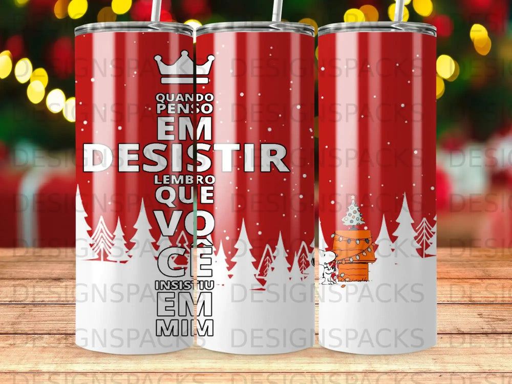 Tumbler with Snoopy wearing a Santa hat by a Christmas tree.