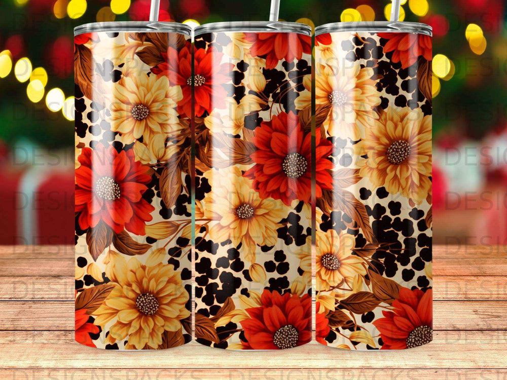 Floral and leopard print tumbler with straw and bokeh lights in background.