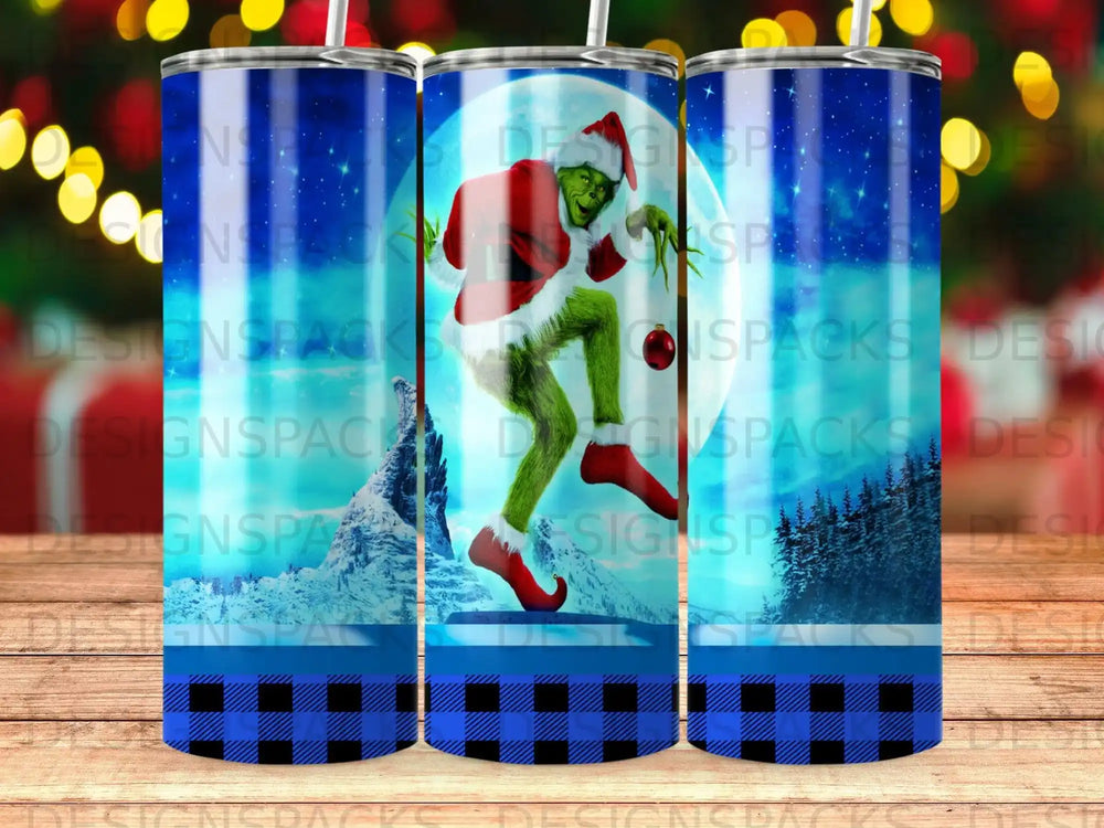 The Grinch in Santa costume holds an ornament on a tumbler with a checkered background.