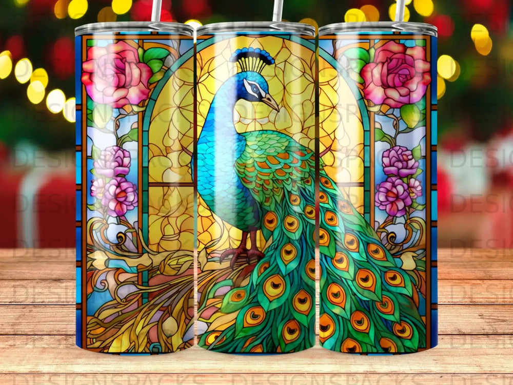 Stained glass peacock with ornate feathers and floral border on a tumbler.