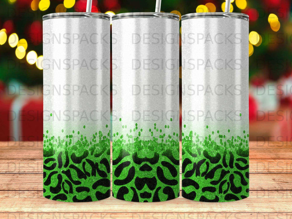 Three tumblers with green glitter and black leopard print designs.