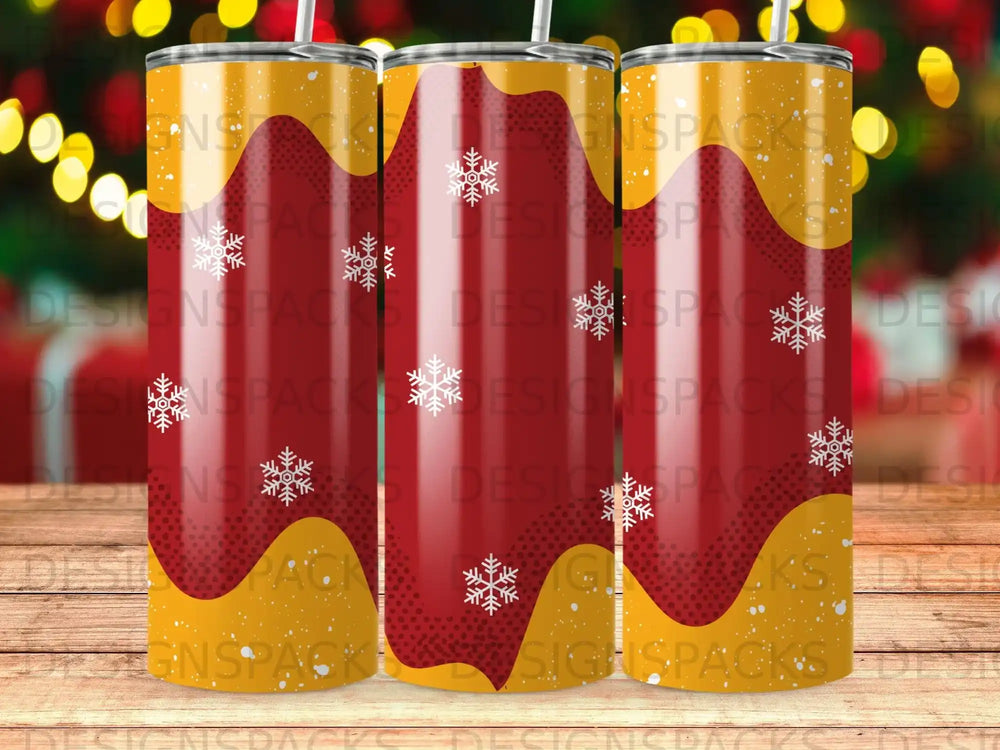 Three tumblers with a red and yellow snowflake pattern.