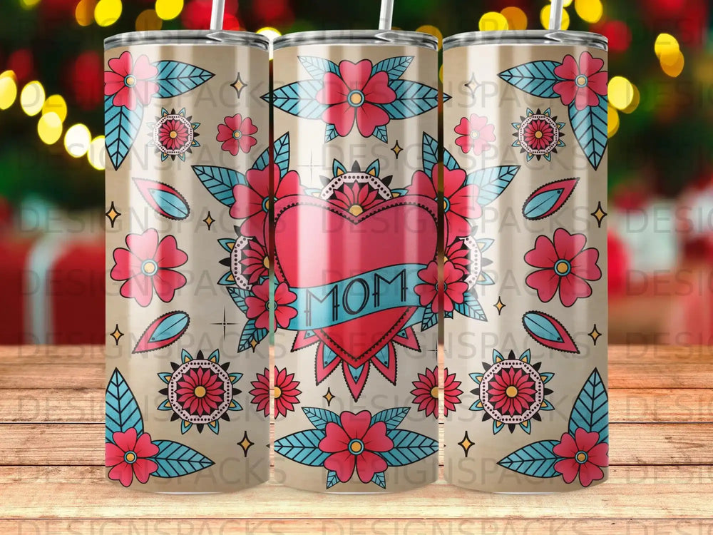 Tumbler with heart, flowers, and "MOM" text in tattoo style.