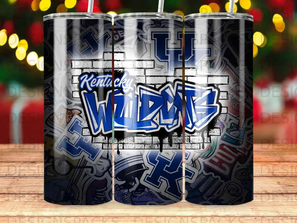 Kentucky Wildcats graffiti-style tumbler with brick and sticker background.