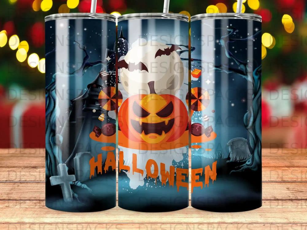 Halloween tumbler with a pumpkin, haunted house, graveyard, and moon.