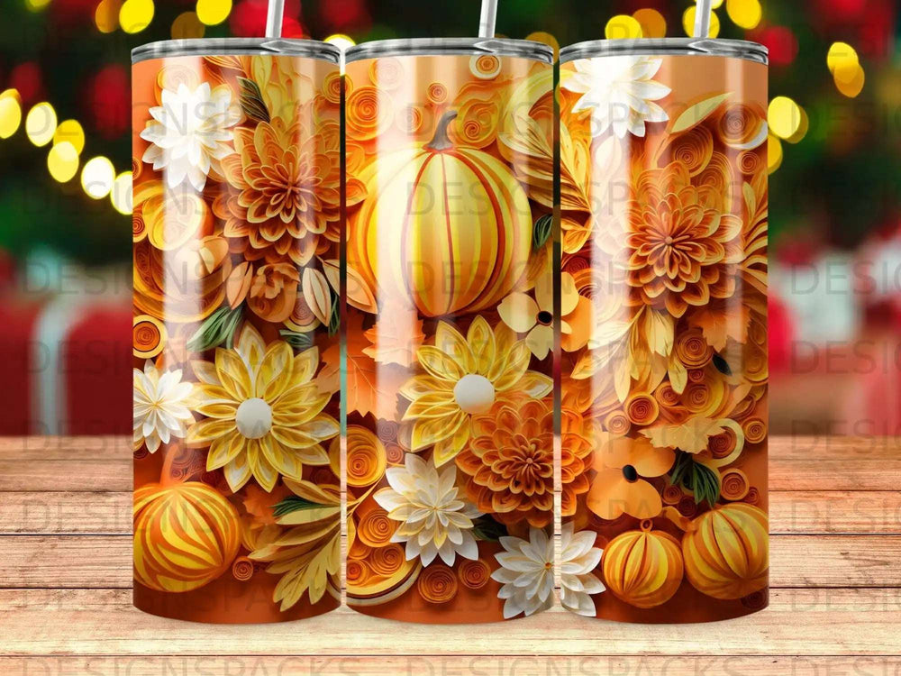 Orange floral pumpkin tumbler with festive lights in background.