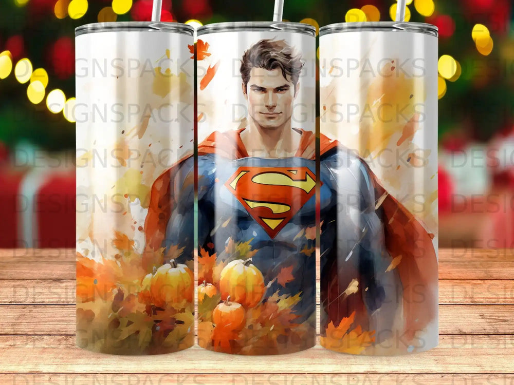 Superman with pumpkins and autumn leaves on a tumbler.
