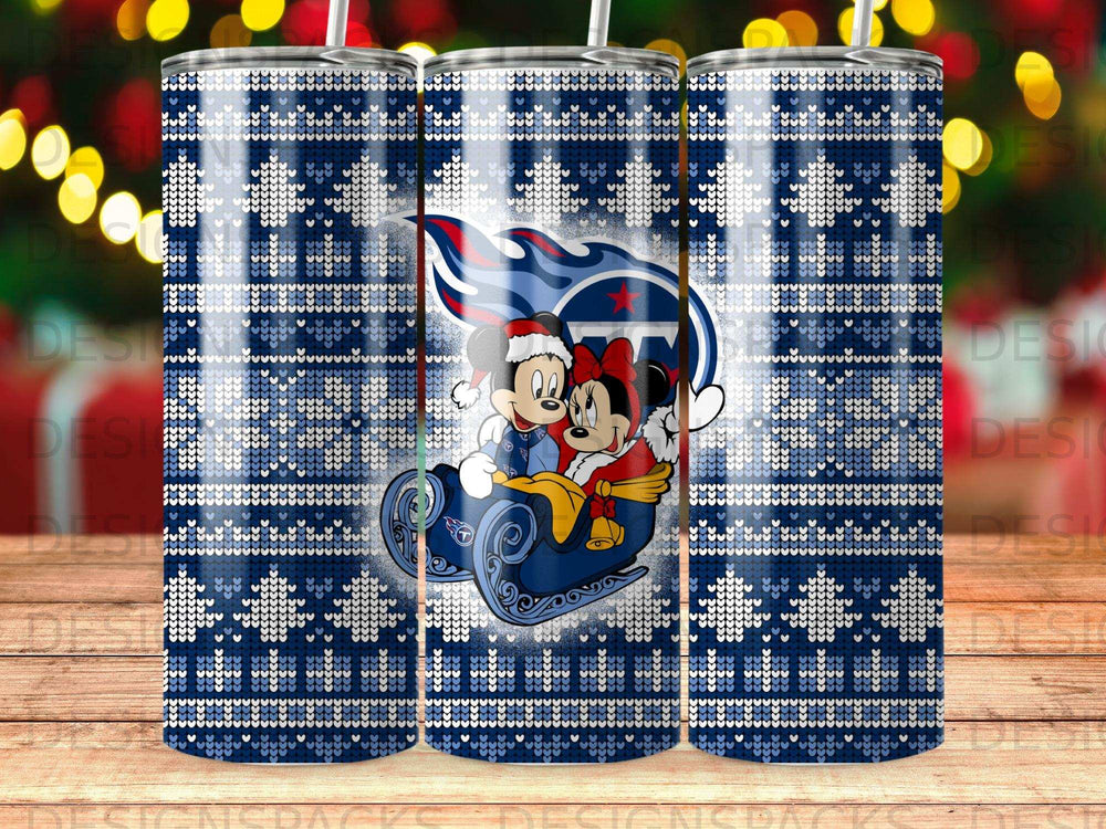 Mickey and Minnie Mouse in a sleigh with the Tennessee Titans logo, on a blue snowflake pattern tumbler.