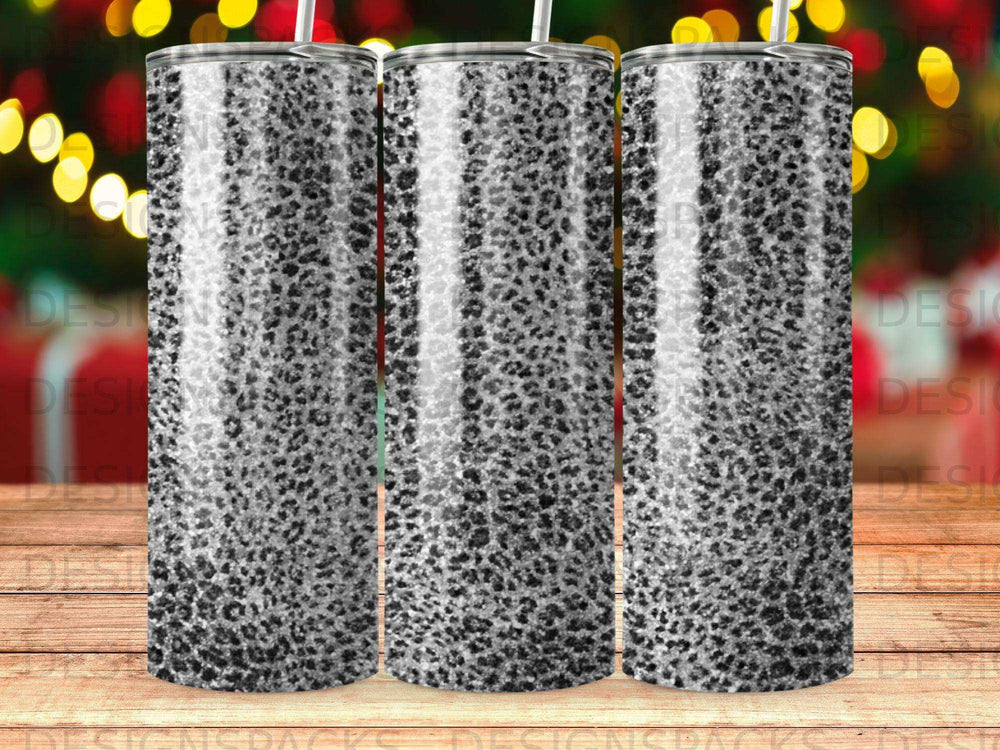 Three tumblers with a black and white leopard print design.