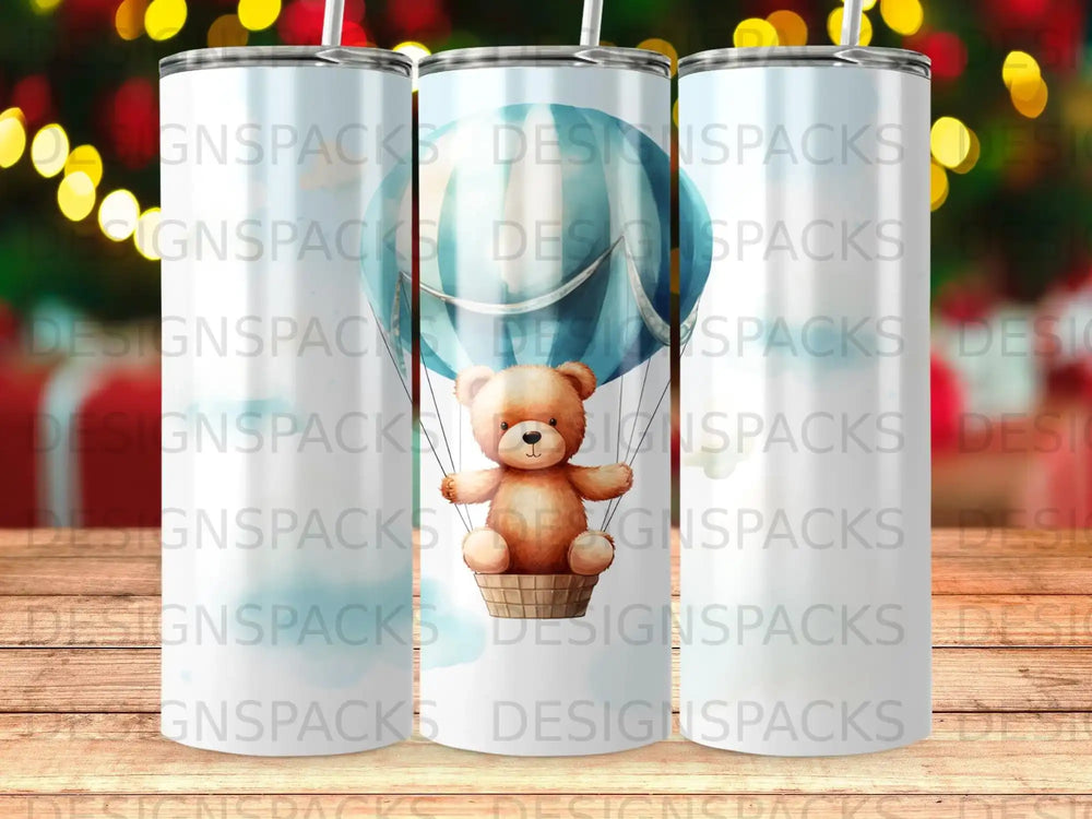 Cute teddy bear in a basket, riding a hot air balloon, on a tumbler.